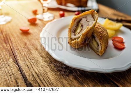 Traditional French Cuisine Chicken Roll Cordon Bleu Or Gordon Blue With Cheese, Ham And Potatoes