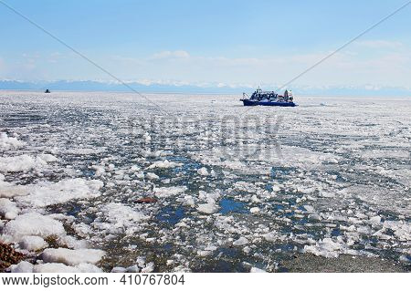 Hovercraft On Of The Baikal Lake In The Spring. Small Ice Floes In The Lake Water. A Sunny April Day