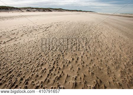 The North Sea Beach On A Sunny Stormy Winter Day With Drifting Beach Sand Near The Slufter Valley On