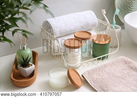 Personal Hygiene Products On Table Near White Wall In Bathroom