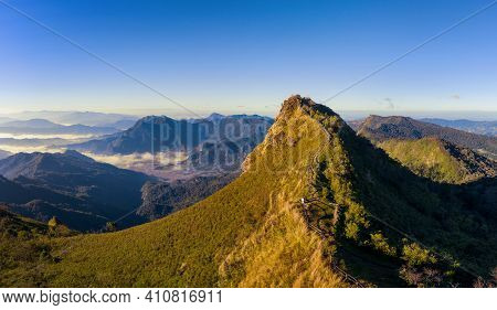 Phu Chi Dao At Sunrise In Chiang Rai, Thailand.