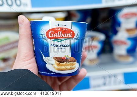 Tyumen, Russia-february 26, 2021: Pack Of Italian Galbani Mascarpone In The Buyer Hand