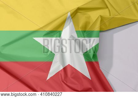 Myanmar Fabric Flag Crepe And Crease With White Space, Red Green And Yellow Color And White Star.