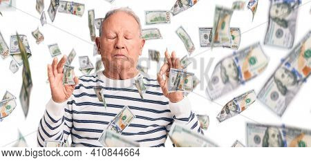 Senior handsome grey-haired man wearing casual striped sweater relax and smiling with eyes closed doing meditation gesture with fingers. yoga concept.