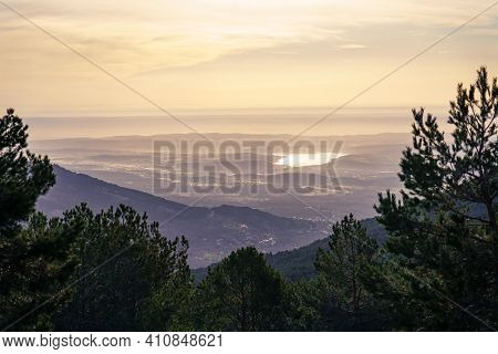Green Mountain Landscape, At Sunrise With Golden Tones And A View Of The Horizon With Large Areas Of