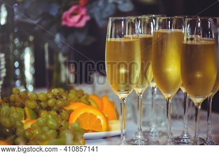 Buffet. The Dining Room Is Full Of Glasses Of Sparkling White Wine With Canapes And Antipasti In The