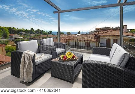 Recreation Concept Panorama Of Modern Patio With Wicker Grey Rattan Furniture. Contemporary Armchair