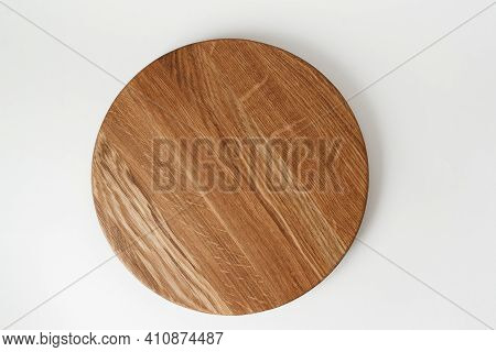 Round Wooden Tray On White Background. Dishes Made Of Natural Materials. Wooden Tableware.