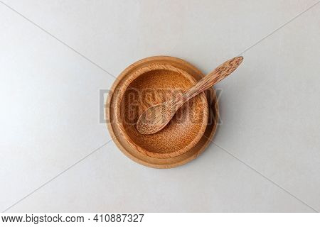 Wooden Utensils On The Kitchen Table. Round Wooden Plates, A Wooden Spoon. The Concept Of Serving, C