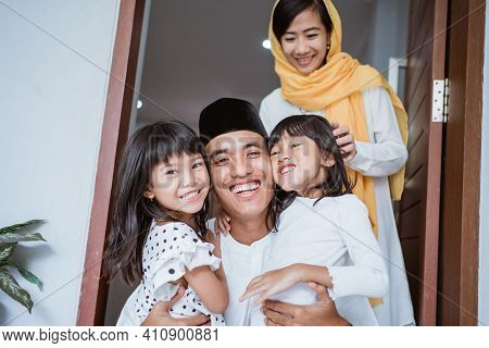 Excited Father Hug And Embrace His Children During Eid Mubarak Celebration