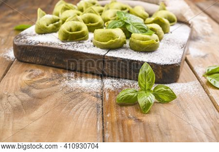 Tortellini E Tortelloni Typical Dishes Emilia Italy. Food Background With Homemade Raw Italian Torte