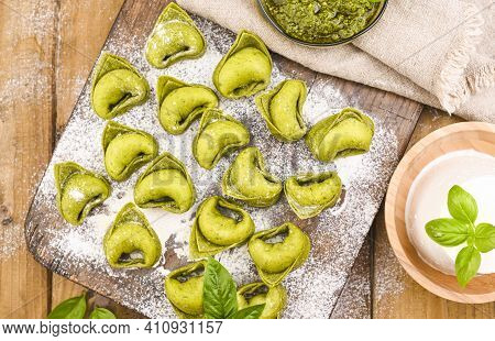 Tortellini E Tortelloni Typical Dishes Emilia Italy. Food Background With Homemade Raw Italian Torte
