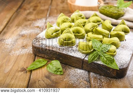 Tortellini E Tortelloni Typical Dishes Emilia Italy. Food Background With Homemade Raw Italian Torte