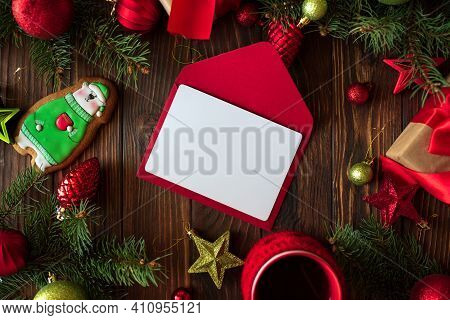 Hot Christmas Tea With Gingerbread Cookie On Wooden Table. Top View. New Year And Christmas Celebrat