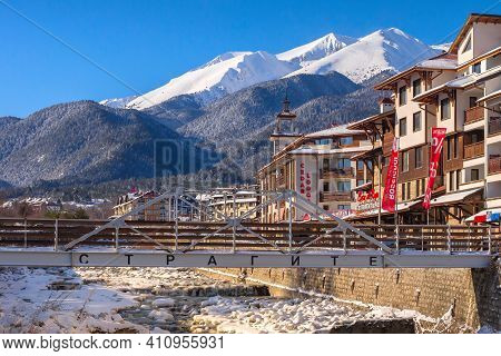 Bansko, Bulgaria - January 28, 2021: Glazne River In Bulgarian Town, Hotel Houses And Snow Pirin Mou
