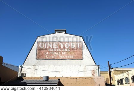 SANTA ANA, CALIFORNIA - 25 FEB 2021: Sign on the Cine Yost building, the oldest theater in Orange County. Translation: City of Gold -  Movies and Variety.