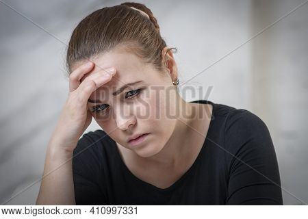 Portrait Of Sad Upset Frustrated Girl, Young Lonely Desperate Woman Holding Her Head With Hand, Suff