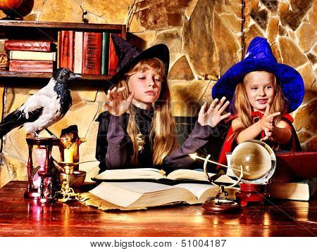 Witch  children with crystal ball. Halloween.