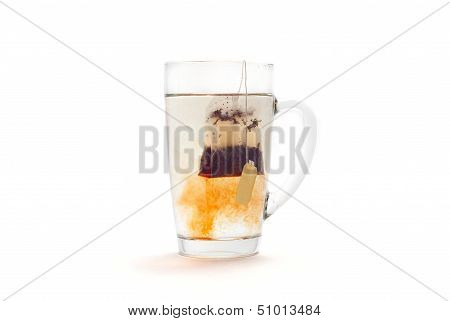 Tea with lemon in a glass cup on