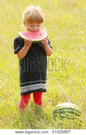 Beautiful Little Girl Eating Watermelon
