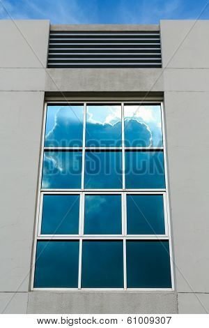 clouds reflection on office window  building