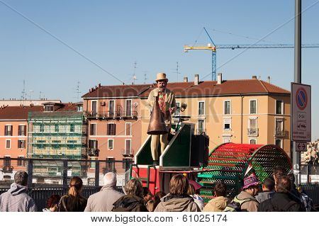 Performer Calls People Using A Vintage Loudhailer At Milan Clown Festival 2014