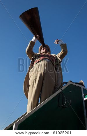 Performer Calls People Using A Vintage Loudhailer At Milan Clown Festival 2014
