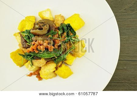 Tofo Fried With Carrot Basil Mushroom On Plate