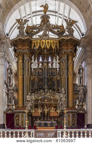 Lisbon, Portugal - September 15, 2013: Baroque altar under baldachin. Church of the Sao Vicente de Fora Monastery. Very important monument in Lisbon, Portugal. 17th century Mannerism