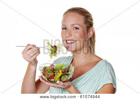 a young woman eating a crisp salad in the lunch break. healthy diet with vitamins.