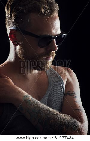 Young Man in Profile with Tattoos