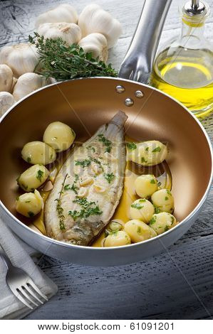 sole fish with potatoes over casserole