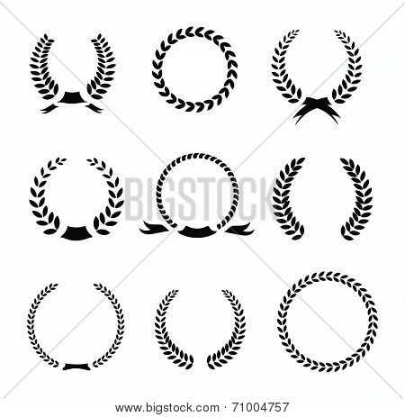 Set of black and white silhouette circular laurel  foliate  wheat wreaths depicting an award  achiev