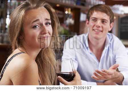 Couple On Unsuccessful Blind Date In Restaurant