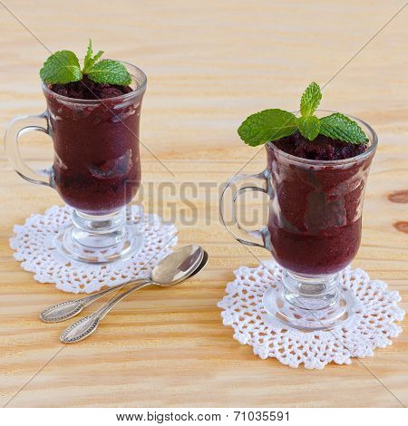 Acai Pulp With Fresh Mint In Glass On Crochet Doily