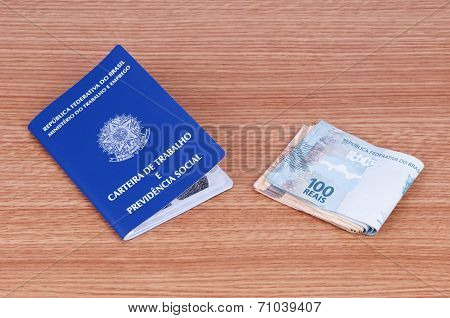 Brazilian Work Document And Social Security Document (carteira De Trabalho) And Brazilian Currency (