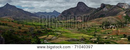 Green valley with rice fields and villages among mountains. Anja reserve, Madagascar