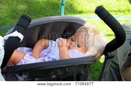 doll in a buggy