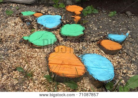Coloured stubs with grass and sawdusts on a ground in a dacha garden