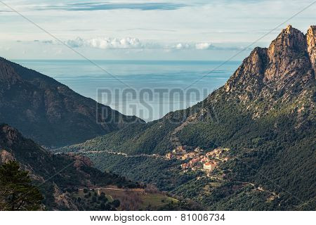 Ota In Corsica With Mountains And Mediterranean Sea