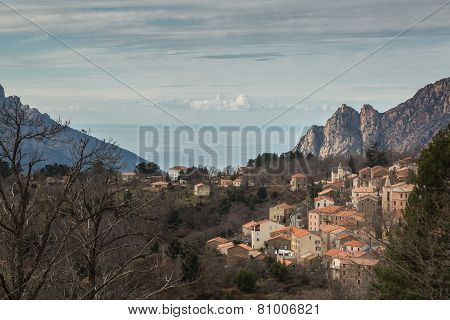 Evisa In Corsica With Mountains And Sea Behind
