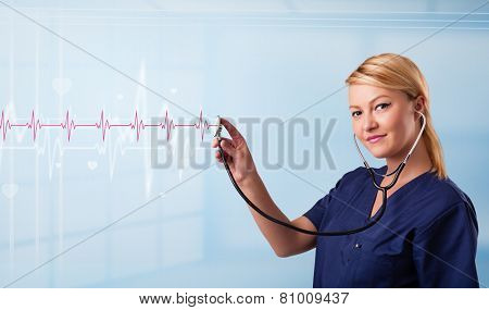 Pretty young medical doktor listening to red pulse and heart rates