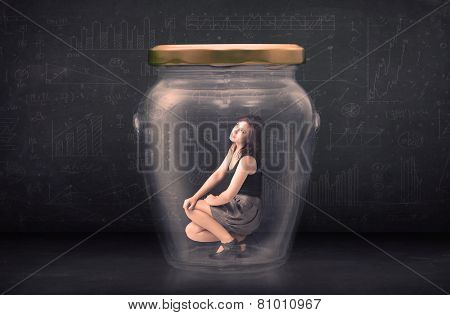 Businesswoman shut inside a glass jar concept concept on background
