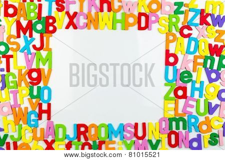 Alphabet Magnets Forming Frame On Whiteboard