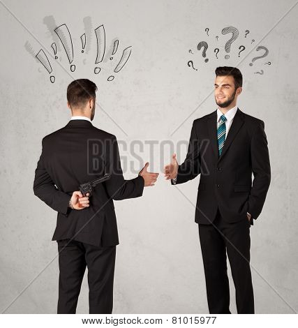 Ruthless businessman handshake with drawn exclamation and question marks around them head