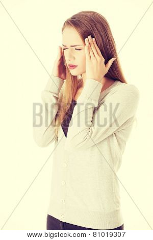 Beautiful cacuasian woman having headache.