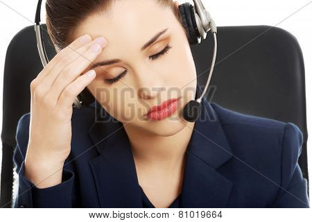 Portrait of anoyed support phone operator in headset
