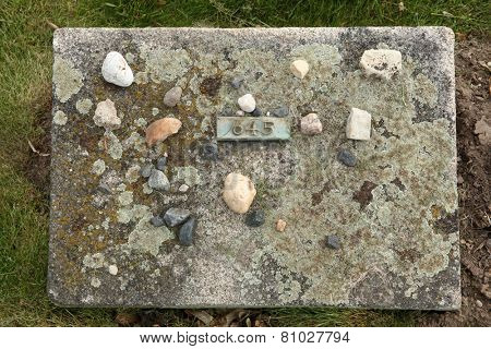 Jewish stones put on the grave an unknown victim of the Ghetto Terezin at the National Cemetery in Terezin, Czech Republic.