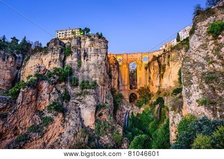 Ronda, Spain at Puente Nuevo Bridge at dusk.