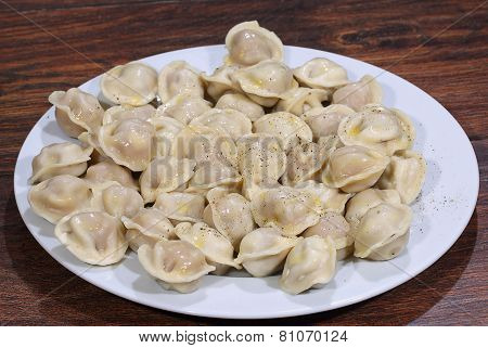 Ready Pelmeni Submitted With The Butter, Strewed By Ground Pepper
